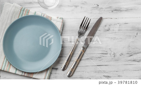Empty plate on light wooden background Empty plate on light wooden background 39781810