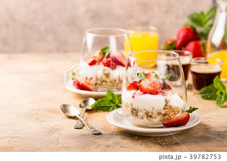 Healthy dessert with granola and berries 39782753