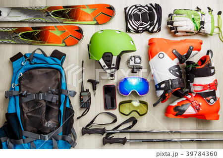 Picture of skier objects on wooden background. 39784360