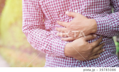 Man having chest pain - heart attack outdoors. 39785086