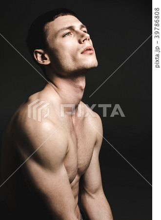 Wistful male stripped to waist 39786808