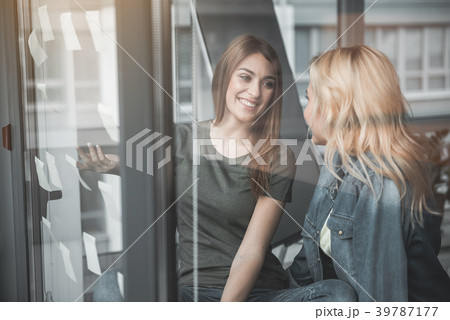 Cheerful colleagues planning corporate strategy Cheerful colleagues planning corporate strategy 39787177