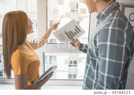 Two colleagues viewing business statistics Two colleagues viewing business statistics 39788223