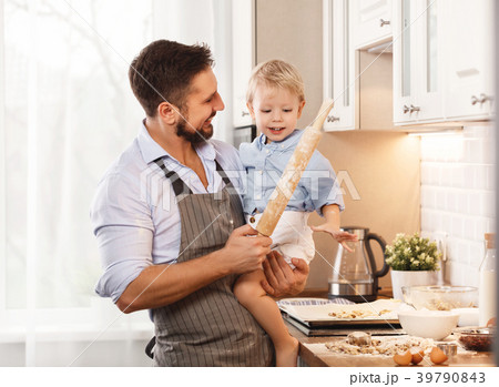 happy family in kitchen. father and child baking cookies  . 39790843