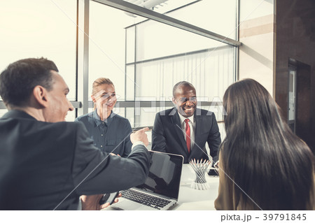 Cheerful colleagues talking during labor in office 39791845