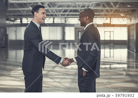 Smiling businessmen locating in warehouse 39791932