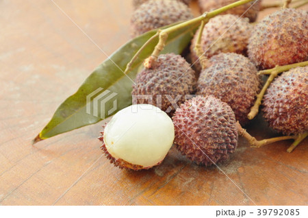 lychee tropical fruit peel out on wooden  39792085