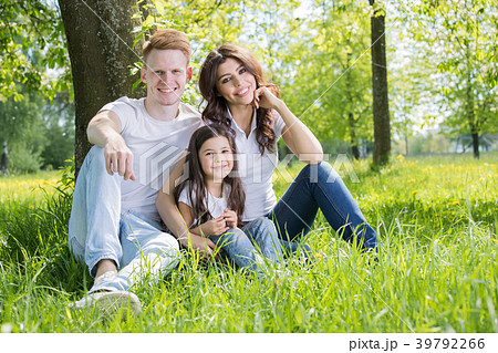 Happy family in park Happy family in park 39792266