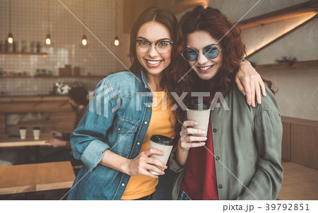 Carefree female friends having rest in cozy cafe 39792851