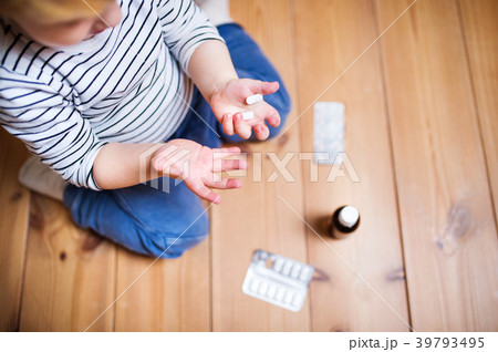 Toddler boy in a dangerous situation at home. 39793495