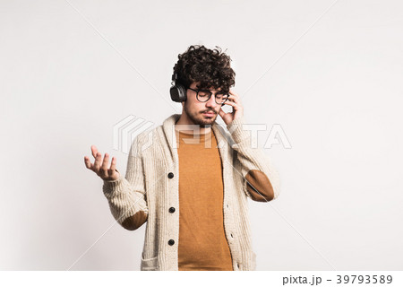 Portrait of a young man with headphones in a Portrait of a young man with headphones in a 39793589