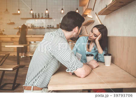 Cheerful young man and woman flirting in cafeteria 39793706