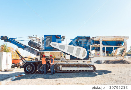 Stone Crusher machine working on road construction 39795258