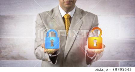 IT Manager Showing A Locked And An Open Padlock 39795642