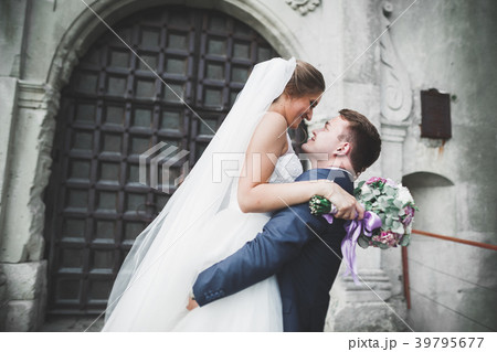 Beautiful fairytale newlywed couple hugging near Beautiful fairytale newlywed couple hugging near 39795677