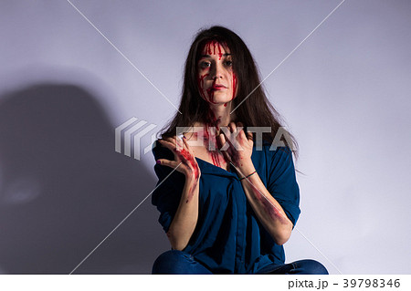 Rape battered bloody victim sad woman sits on the 39798346