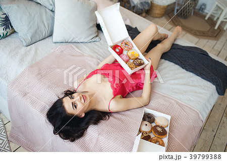 Beautiful slim sexy girl is lying in bed with 39799388