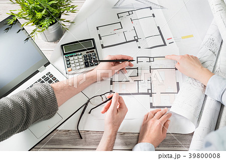 Designers discuss the sketches inside the house. 39800008