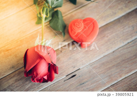 Red rose flower on wooden floor in Valentine's Day Red rose flower on wooden floor in Valentine's Day 39805921