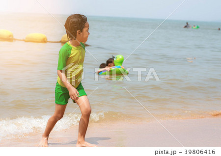 Girl is walking on beach. 39806416