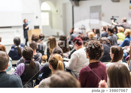 Woman giving presentation on business conference. Woman giving presentation on business conference. 39807067