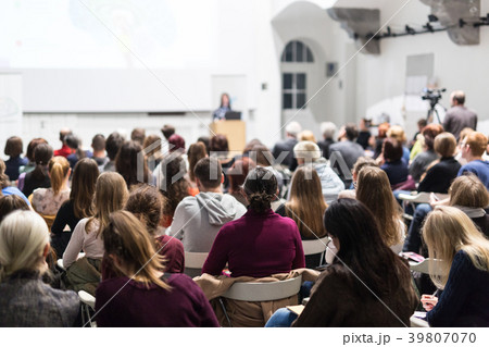Woman giving presentation in lecture hall at Woman giving presentation in lecture hall at 39807070