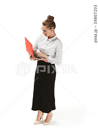 Full length portrait of a smiling female teacher Full length portrait of a smiling female teacher 39807203