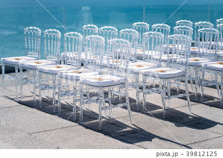 Ghost chairs setup for modern beach wedding venue 39812125
