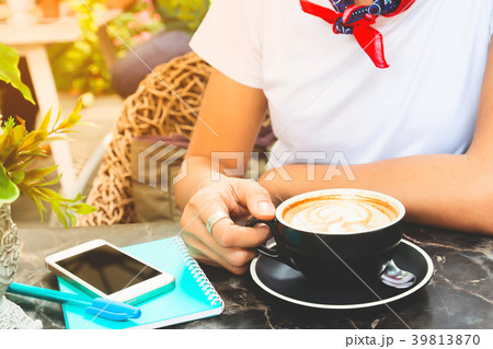 Woman in casual style clothing drinking coffee 39813870