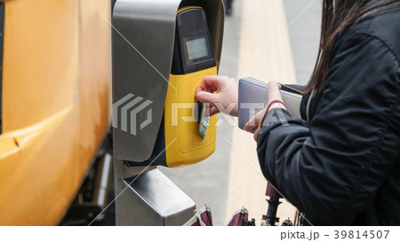 Passengers validating tickets, rush to the train,  39814507