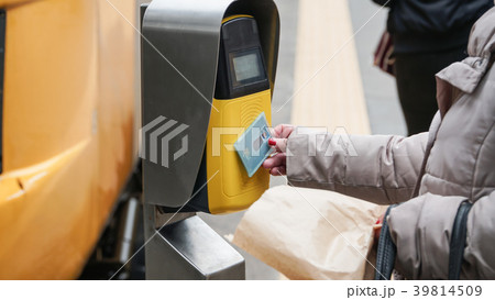 Passengers validating tickets, rush to the train,  39814509