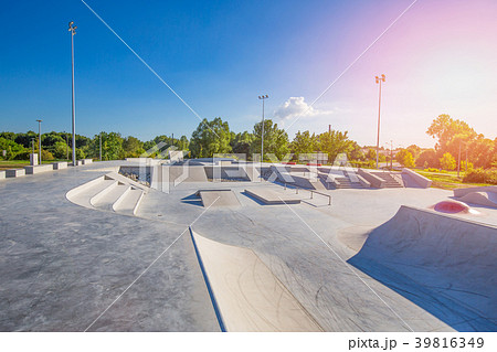 Skate Park in daytime. Urban concrete skatepark. 39816349