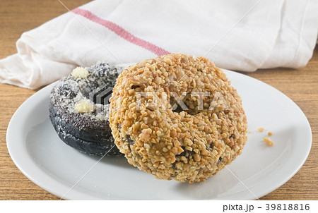 Dish of Fresh Chocolate Donut and Peanuts Donut Dish of Fresh Chocolate Donut and Peanuts Donut 39818816