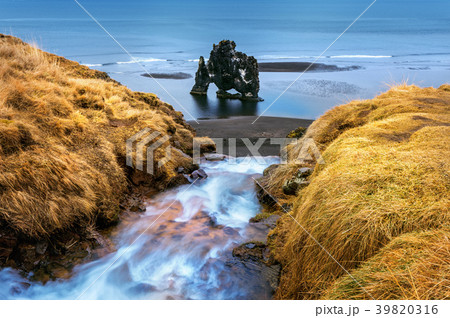 Waterfall and Hvitserkur. Waterfall and Hvitserkur. 39820316