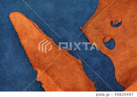 Close up orange rough edge and blue leather 39820497