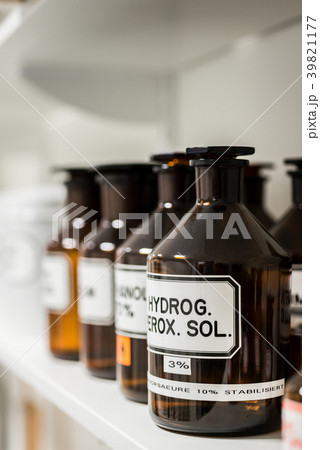 Close-up of the labeled glass container of a 39821177