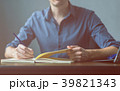 Businessman writing a document on notebook 39821343