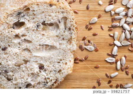 Loaves of gray bread with seeds, in a paper bag Loaves of gray bread with seeds, in a paper bag 39821757