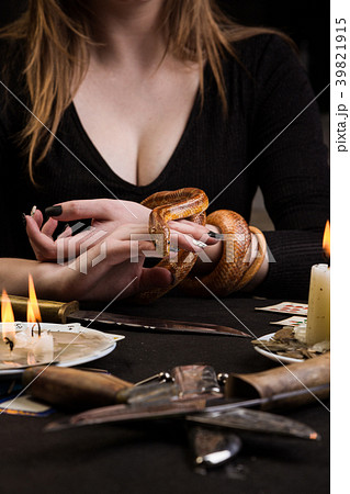 A woman will hold her hand to a snake A woman will hold her hand to a snake 39821915