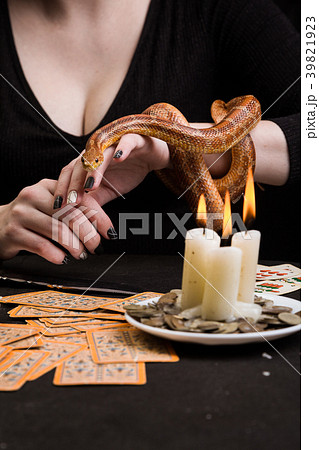 A woman will hold her hand to a snake A woman will hold her hand to a snake 39821923