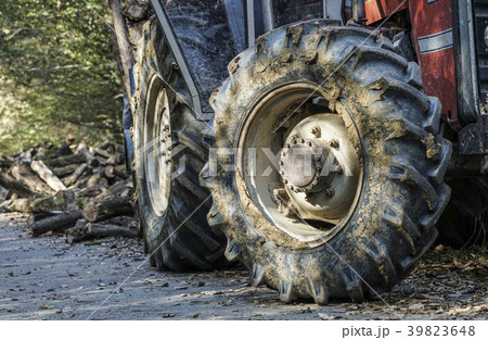 tyre of a tractor covered in mud 39823648