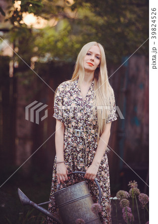 Beautiful young woman in a studded summer Beautiful young woman in a studded summer 39824526
