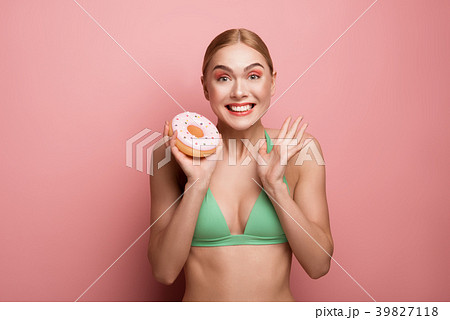 Cheerful girl enjoying delicious dessert Cheerful girl enjoying delicious dessert 39827118