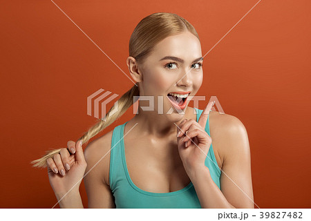 Cheerful woman with cared hair Cheerful woman with cared hair 39827482