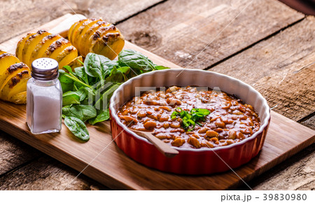Spicy cowboy beans with hassleback potatoe with herbs Spicy cowboy beans with hassleback potatoe with herbs 39830980