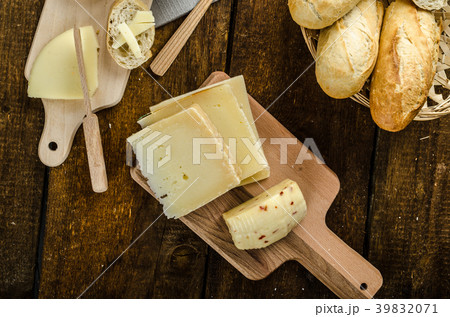 Delicious ripe cheese with crispy baguette and wine Delicious ripe cheese with crispy baguette and wine 39832071