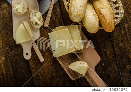 Delicious ripe cheese with crispy baguette and wine Delicious ripe cheese with crispy baguette and wine 39832072
