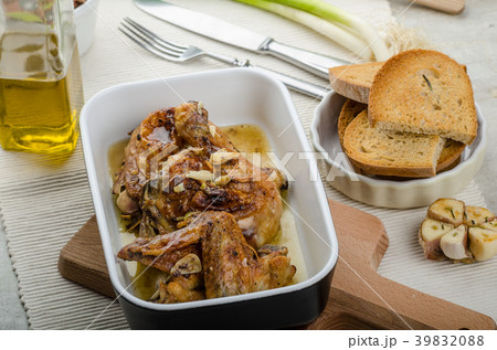Roasted chicken parts with bio garlic, herb-garlic toast Roasted chicken parts with bio garlic, herb-garlic toast 39832088