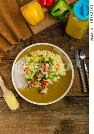 Couscous with vegetables and chicken skewer Couscous with vegetables and chicken skewer 39832233