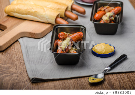 Fried sausage in a robe of bacon and cheese 39833005